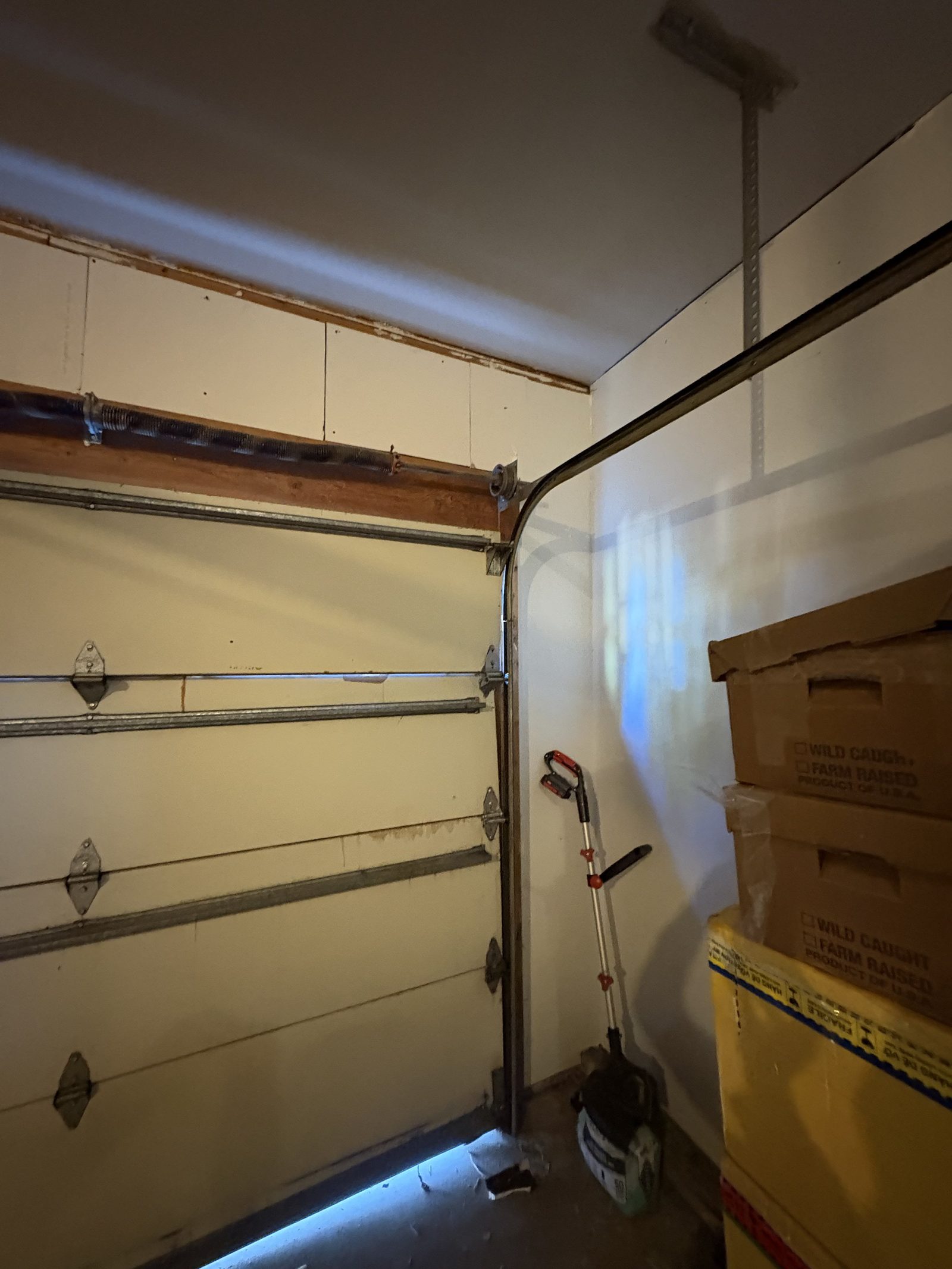 Garage door opener and spring system installation