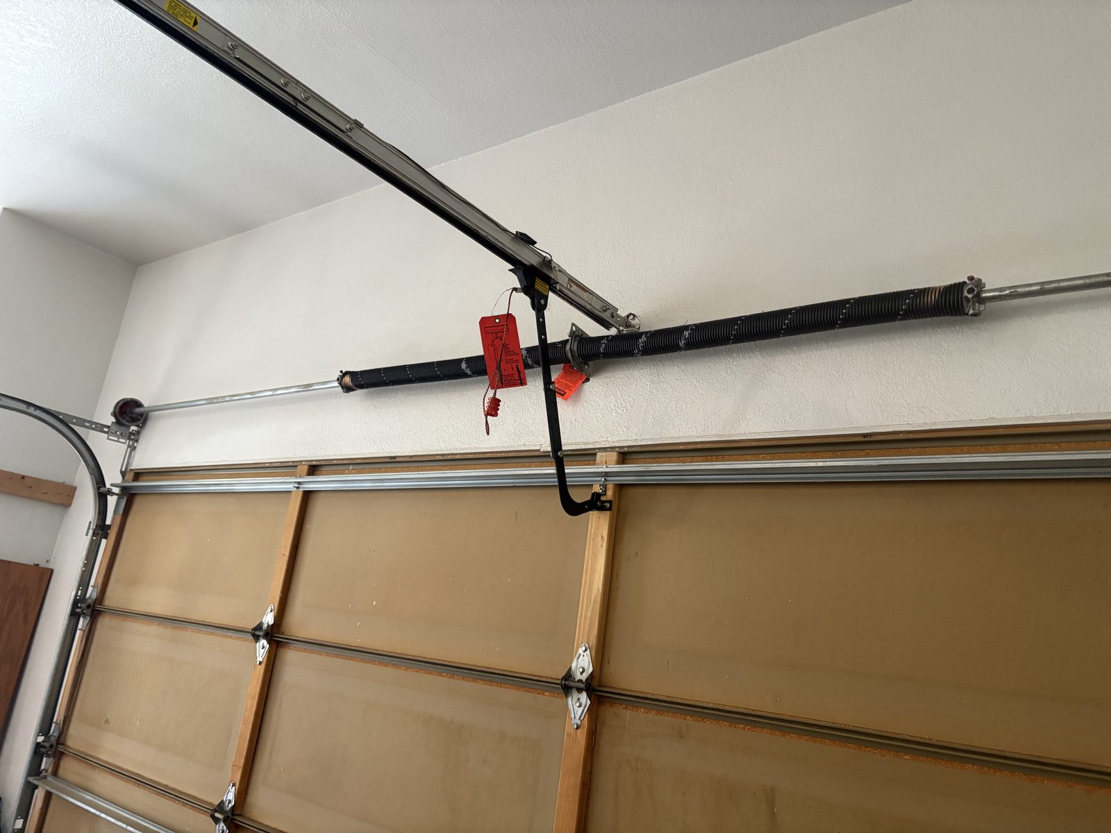 Broken garage door spring replacement close-up