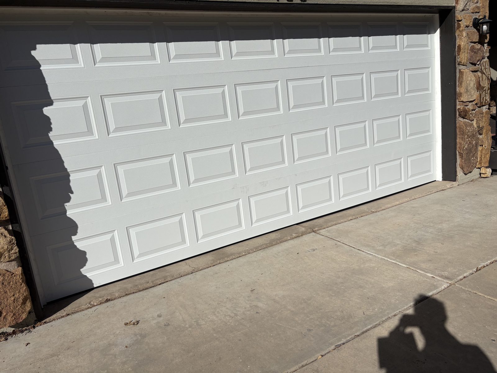 White double garage door panel replacement project